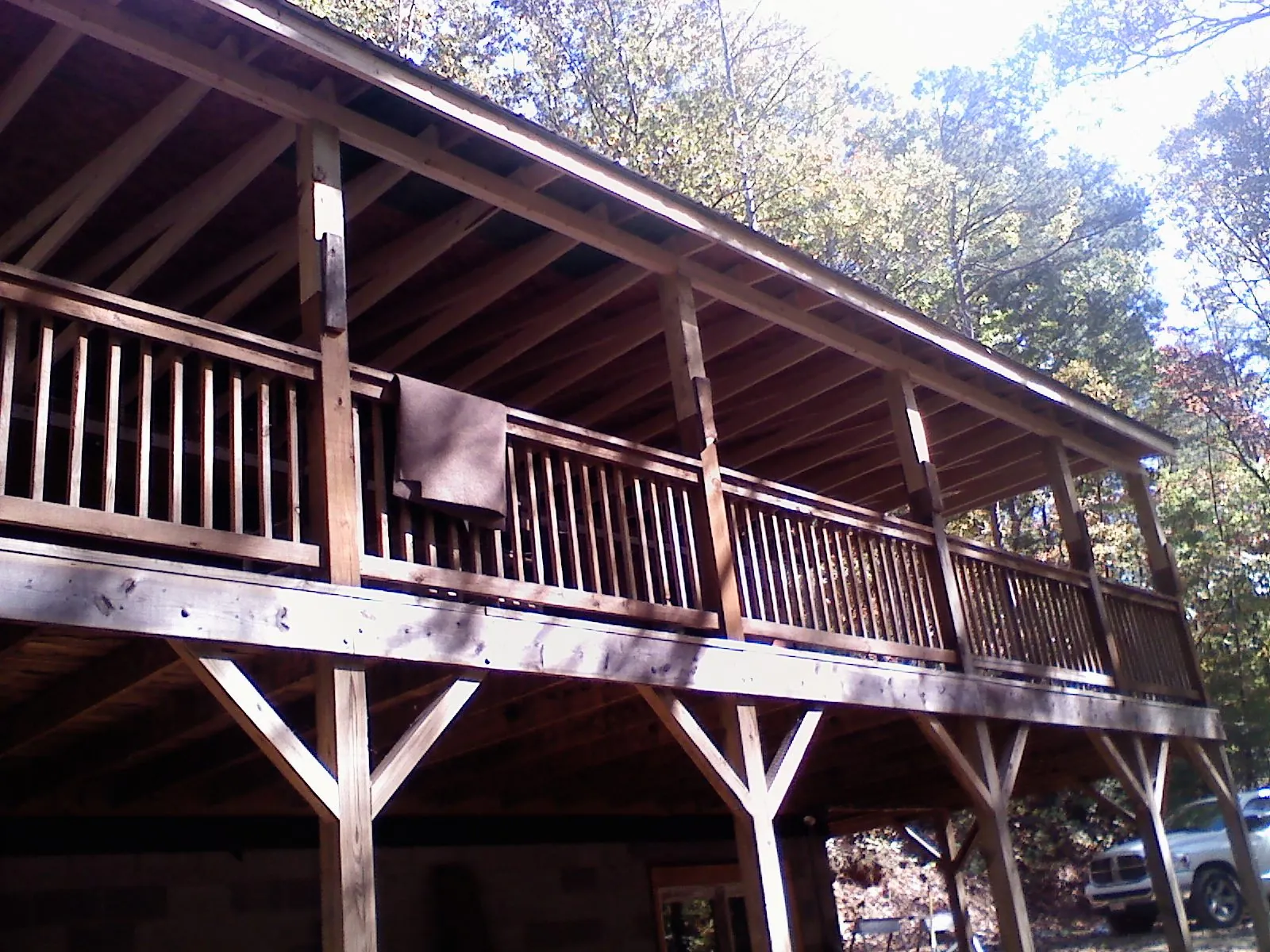 Timber framing under a new elevated porch and deck — Roof Leak Repair in West Frankfort by Roofing Brothers